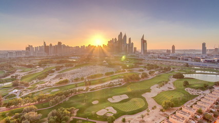 Dubai Marina skyscrapers and golf course sunset timelapse, Dubai, United Arab Emirates