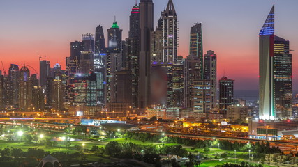 Fototapeta na wymiar Dubai Marina skyscrapers and golf course day to night timelapse, Dubai, United Arab Emirates