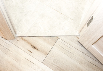 Installation of threshold indoors. Renovation works in the flat.