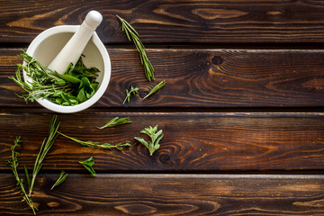 Store up medicinal herbs on wooden background top view space for text