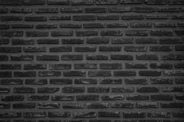 Abstract Wall black brick wall texture background pattern, brick surface backgrounds. Vintage Brickwork or stonework flooring interior rock old clean concrete grid uneven, wall bricks design.