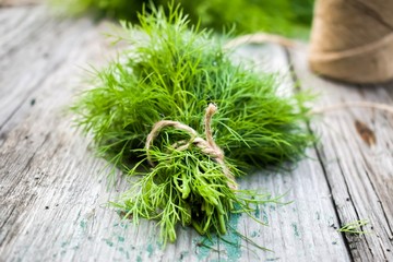 bunch of fresh dill on wooden table