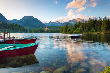 Sunrise view in High Tatras mountains national park and Strbske pleso  (Strbske lake) mountain lake in Slovakia