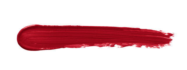 Lipstick smear smudge swatch isolated on white background. Creamy makeup texture. Red color...