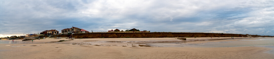 Fototapeta na wymiar yellow sand on the coast of the sea, seascape 