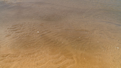 yellow sand on the coast of the sea, seascape 