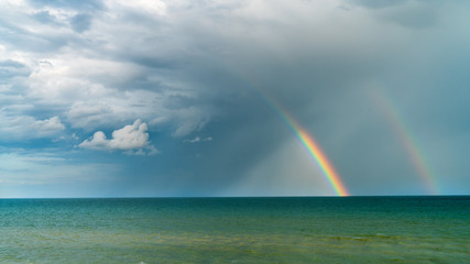 rainbow over the blue sea, seascape as background
