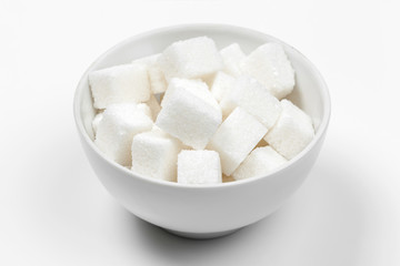 Group of refined white sugar cubes close up