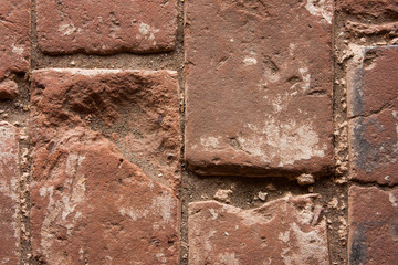 fragment of an old destroyed brick road, selective focus