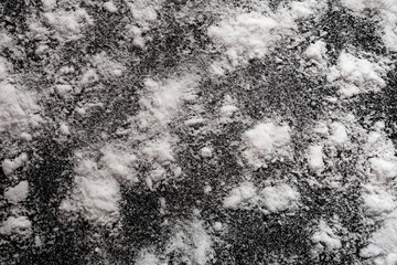 White powder on black background. Isolated abstract pattern for cooking, medical or chemical design...