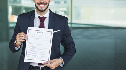 Close-up smiley lawyer holding a contract