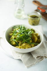 Homemade potato salad with pesto and arugula