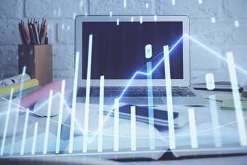 Forex Chart hologram on table with computer background. Multi exposure. Concept of financial markets.