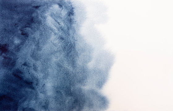 Hand drawn watercolor splash on paper art abstract indigo background illustration