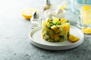 Delicious mango avocado salad on white plate
