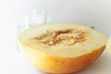 Ripe juicy melon for breakfast. Appetizing melon on a white background. Pumpkin