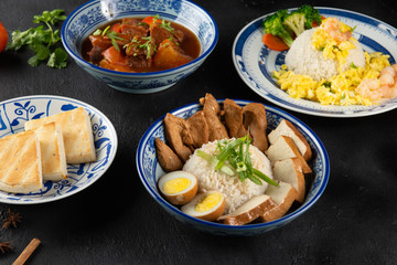 various asian dishes with dark background