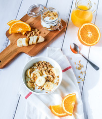 breakfast on wooden table with granola top view