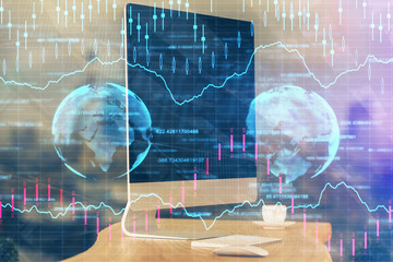Double exposure of graph and financial info and work space with computer background. Concept of...