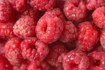 Background from fresh raspberries top view.