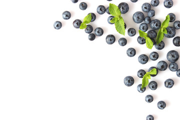 blueberry and mint leaves on a mulberry background top view. Berries.
