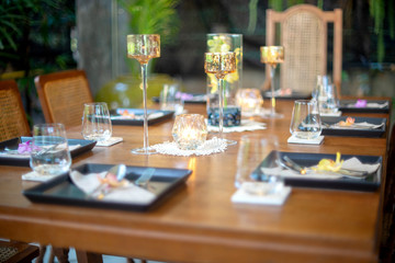 Dinner set on the wood table with long wine glass
