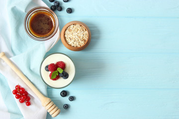 yogurt with berries on the table.