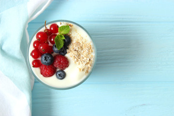 yogurt with berries on the table.