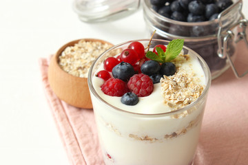 yogurt with berries on the table.