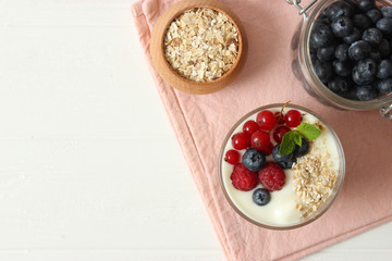 yogurt with berries on the table.