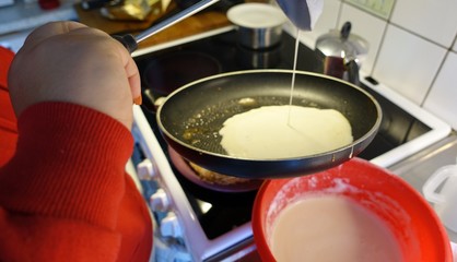 cooking pancakes at home with the family