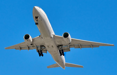 Big modern Boeing jet commercial plane in blue sky including clipping path