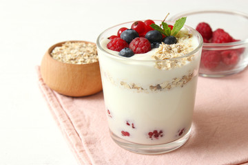 yogurt with berries on the table.