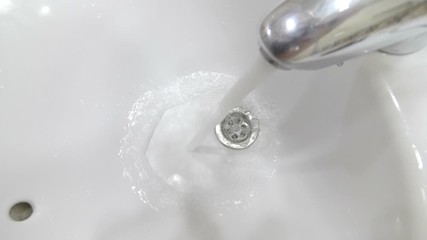 Water flowing from the tap in slow motion 180fps