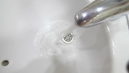 Water flowing from the tap in slow motion 180fps