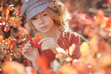 Teen girl in the fall. Beautiful girl in the autumn on the nature. 