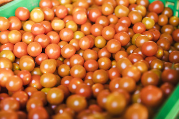 Organic juicy tomatoes for sale on street market