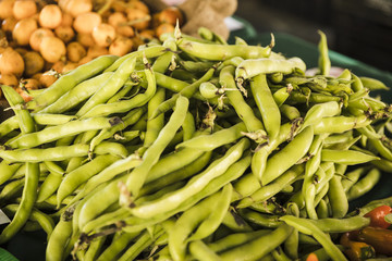 Pile of green peas vegetable at market stall
