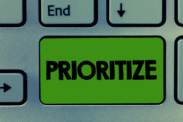 Fototapeta premium Conceptual hand writing showing Prioritize. Business photo showcasing Organize designate or treat something as being more important.