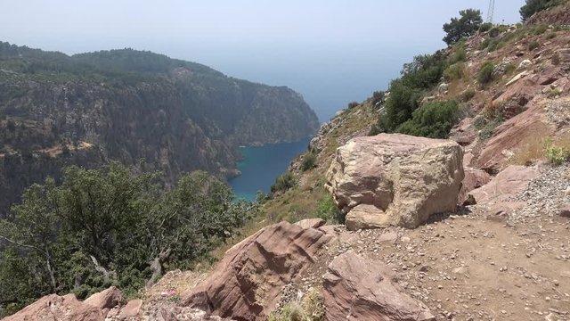Above the Butterfly Valley, Fethiye, Turkey - 12th of June 2019: 4K View on the Butterfly Valley from the mountain