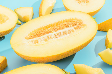 background with melon. sliced sweet and ripe melon on a blue background.