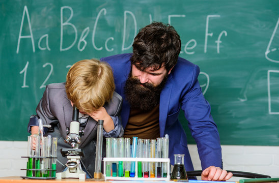 We Make IT Happen. Flask In Scientist Hand With Test Tubes. Son And Father At School. Chemistry And Physics Biology. Wisdom. Back To School. Small Boy With Teacher Man