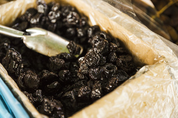 Close-up of black dates for sale in market stall
