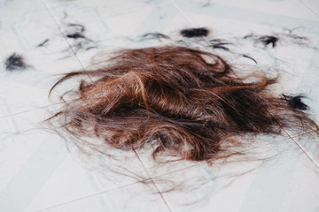 Hair on the floor in the barber shop.