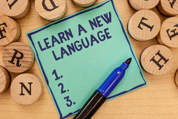 Handwriting text Learn A New Language. Concept meaning Study Words other than the Native Mother...