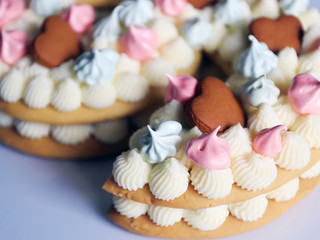 Homemade cake. Decorated with shortbread cookies and meringues. Number nine