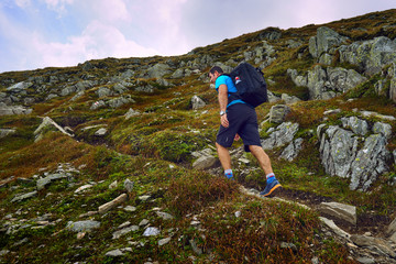 Naklejka premium Hiker with backpack in the mountains