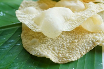 Papad or Papadum - crispy deep fried Indian snack made of lentil