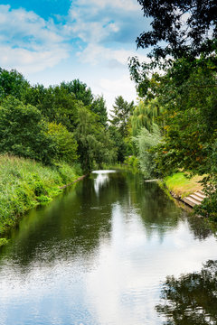 green trees along river Niers. Weeze, Germany