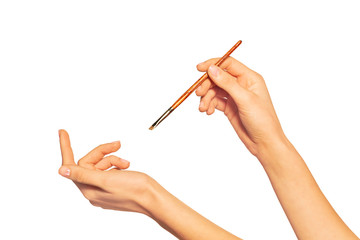 Female hand with eyeshadow brush isolated on white